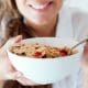 Eating a bowl of cereal with strawberries